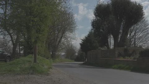 Borley Village looking down the hill on country road - FLAT Stock Footage 160341710