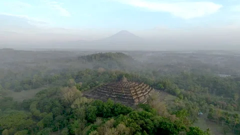 Borobudur temple at sunrise shrouded in fog Stock Footage
