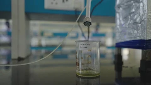 Borosilicate Glass Beaker getting filled Stock Footage 322150729