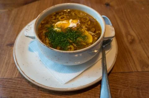 Borscht or borsht soup in a rustic bowl garnished with sour cream and dill Stock Photos