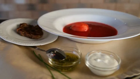 Borscht.The process of pouring traditional Russian borsch soup into a clean Stock Footage 123701429