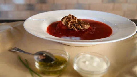 Borscht.Beetroot soup borsch is sprinkled with finely chopped greens. Stock Footage 123885396