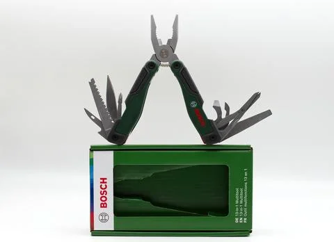 Bosch multitool and packaging isolated on white. Stock Photos