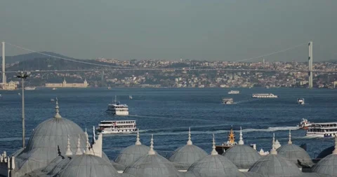 Bosphorus bridge and ferries in the background, domes in the foreground. Stock Footage 247654872