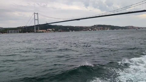Bosphorus Bridge in Istanbul Scenic View from Boat with Ocean Waves Foam Stock Footage 345538337