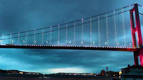 Bosphorus Bridge with Red Lights and Ortakoy Mosque at Night in Istanbul Stock Footage 328259870
