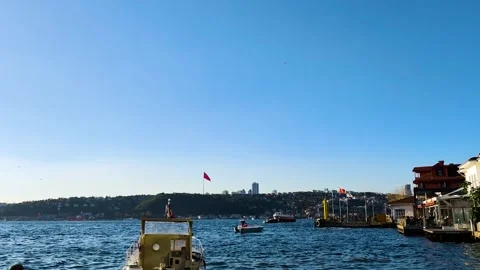 Bosphorus Seafront View with Turkish Flag and Passenger Boats in Istanbul Turkey Stock Footage 326822691