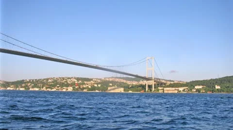 Bosporus Bridge stands against city landscape in Istanbul Stock Footage
