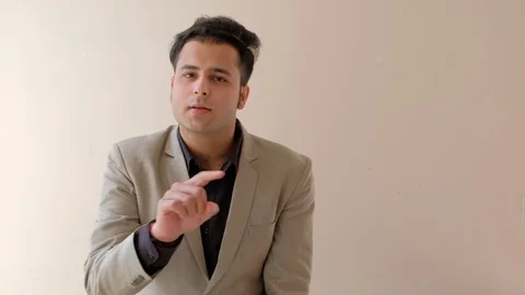 Boss explains the team how to do things to his juniors with hand gestures  Stock Footage 100529865