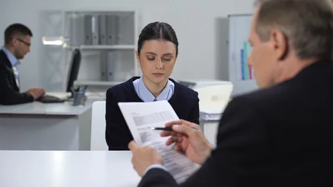 Boss looking through report, shouting on female manager, failed work task Stock Footage 112096989