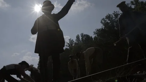 Bossman orders Laborers building the Transcontinental RailRoad - 1800s Portrayal Stock Footage 99755350