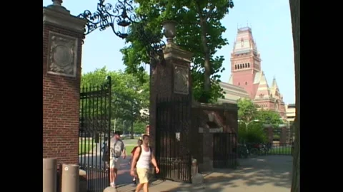 BOSTON - 1999 - Tilt down to a gate at Harvard University which students are Stock Footage 284462773