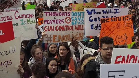 Boston, MA. School shootings, protest march. Gun control, massive crowd, signs. Stock Footage 209645696