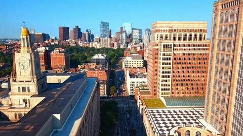 Boston skyline beyond a clock tower and Berkeley Street. An elevated view shows Stock Footage 346190457
