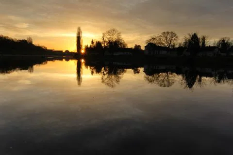 Bosut River Sunset With Tree Reflections in Tranquil Countryside Setting, V.. Stock Photos