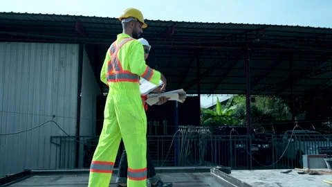 Both of construction engineers verify the constructed precast concrete wall Stock Footage 255351669