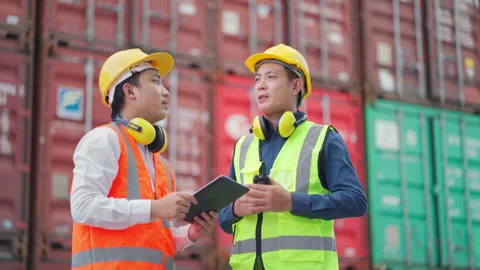 Both engineer discuss in the container yard Video stock 196294693