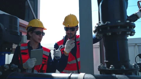 Both of engineers inspecting industrial pipeline and valve systems 스톡 동영상 339644359