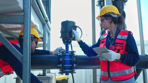 Both of engineers inspecting industrial pipeline and valve systems 스톡 동영상 339645508