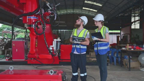 Both of engineers installing and testing a large robotic arm. Stock Footage 254550390