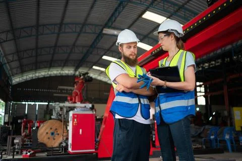 Both of engineers installing and testing a large robotic arm. before sendi... Foto stock