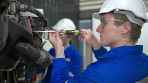 Both of engineers working together in a robotic arm factory, Video stock 262758511