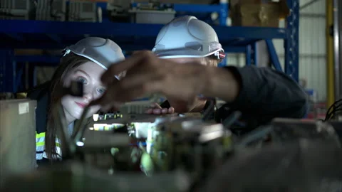 Both of engineers working together in a robotic arm factory, Stock Footage 262759656