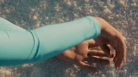 Both hands places on salt flat in Bolivia Video stock 271554993