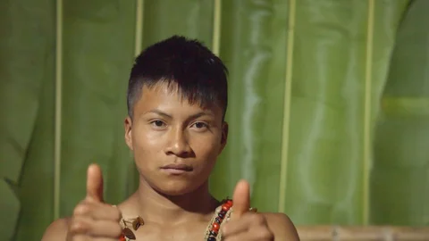 Both hands saying ok to the camera like something good happened or trying to Stock Footage 113180500