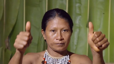 Both hands saying ok to the camera like something good happened or trying to Stock Footage 113184509