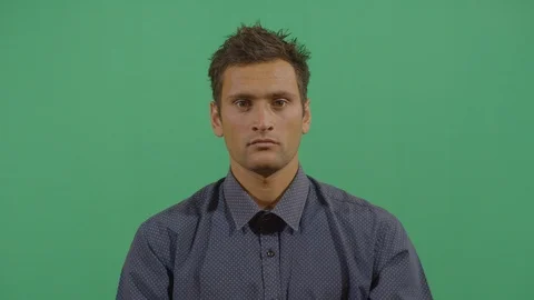 Both hands saying ok to the camera like something good happened or trying to Stock Footage 115325780