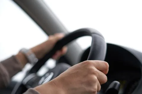 Both hands on steering wheel Stock Photos
