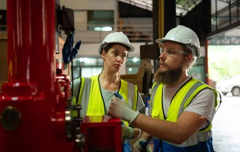 Both of mechanical engineers are checking the working condition of the new... 스톡 사진