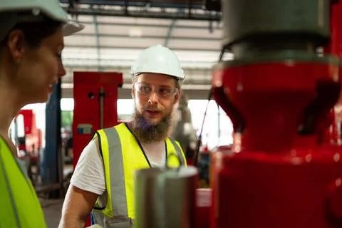 Both of mechanical engineers are checking the working condition of the new... 스톡 사진