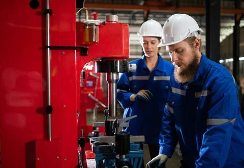 Both of mechanical engineers are checking the working condition of the new... 스톡 사진