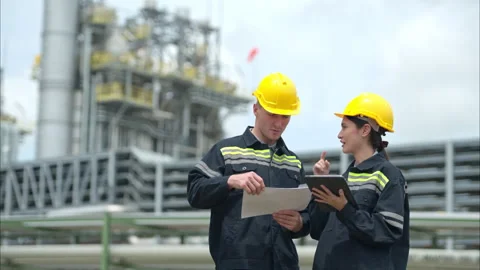 Both of Petroleum engineer is on a mission to inspect oil distillation Stock Footage 292194951