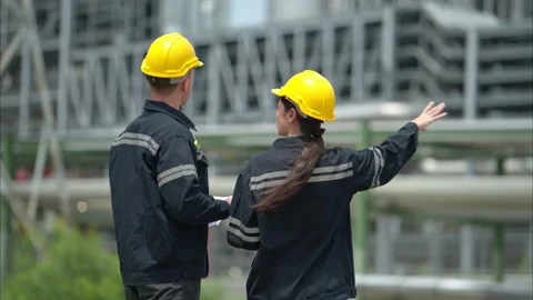 Both of Petroleum engineer is on a mission to inspect oil distillation Stock Footage 292200336
