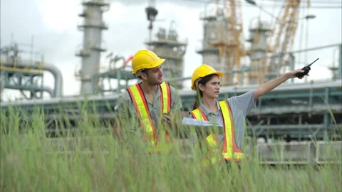 Both of Petroleum engineer is on a mission to inspect oil distillation Stock Footage 292215745