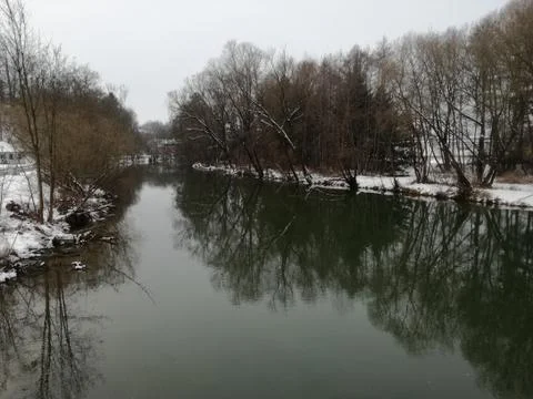 Both  riversides  with trees-shadows Stock Photos