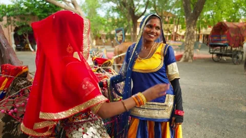 Both smile and talk as standing at rural area Stock Footage 302074014