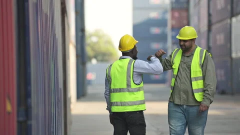 Both of workers in a container storage yard greeting each other Stock Footage 264473654