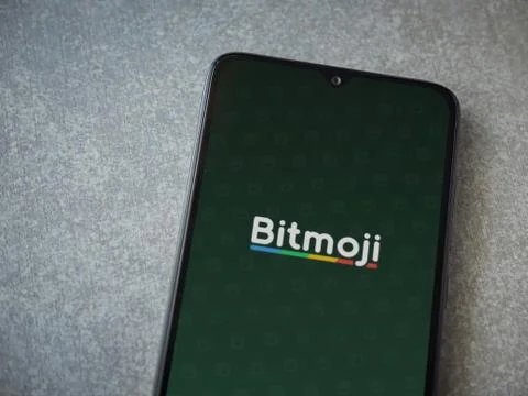 Botmoji app launch screen with logo on the display of a black mobile smartpho Stock Photos