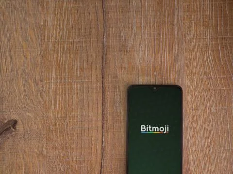 Botmoji app launch screen with logo on the display of a black mobile smartpho Foto stock