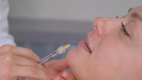 Botox injection on a woman's face in the... | Stock Video | Pond5