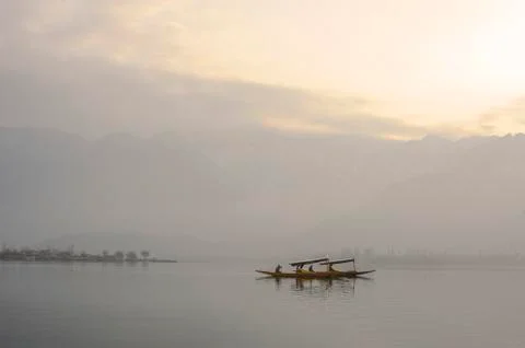 Bots called "Shikara" are often used by residents of Kashmir on the Dal Lake Stock Photos