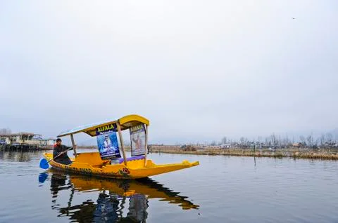 Bots called "Shikara" are often used by residents of Kashmir on the Dal Lake Stock Photos