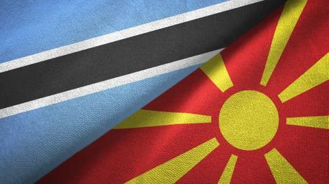 Botswana and Macedonia two flags textile cloth, fabric texture Illustrazione stock