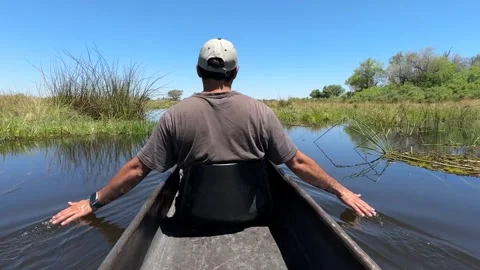 Botswana Canoe with open arms Stock Footage 278276145