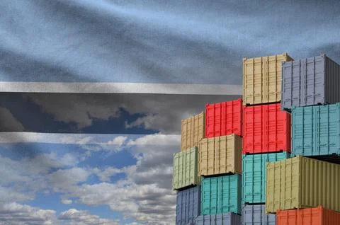 Botswana flag and big stack of shipping cargo containers in docks with sky イラスト素材