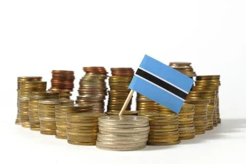 Botswana flag waving with stack of money coins Stock Photos